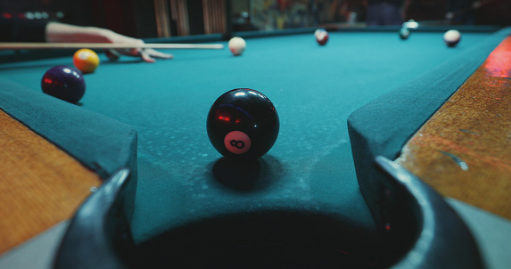 What are pool balls made of